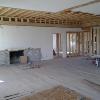 Living room with fireplace and raised ceiling and roof to ten feet.
